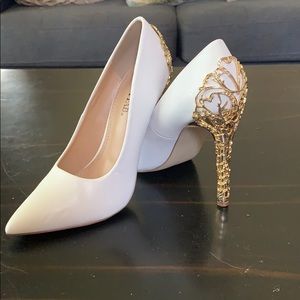 White high heels with gold accent design